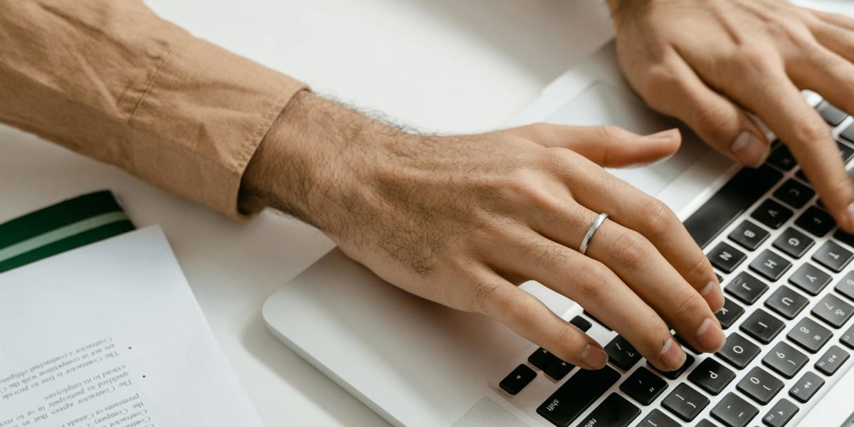 A person diligently checking online reviews and testimonials for real estate agents.