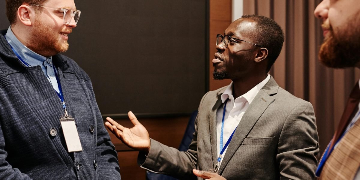 Professionals engaged in a discussion, weighing strategic options for business or investment decisions.
