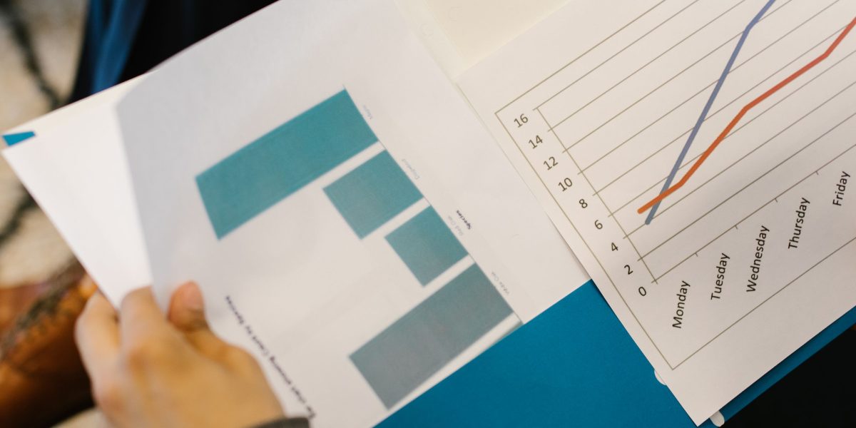 Professionals reviewing financial reports, symbolizing the importance of understanding a developer's financial health.