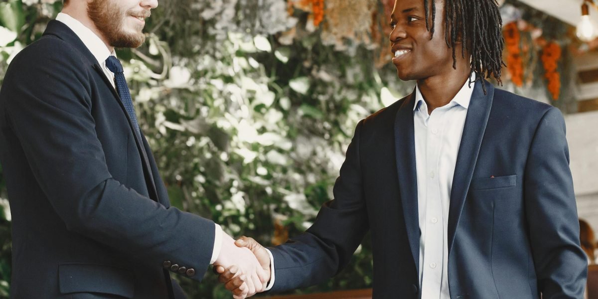 A professional handshake, representing trust, good customer service, and the completion of a successful agreement.