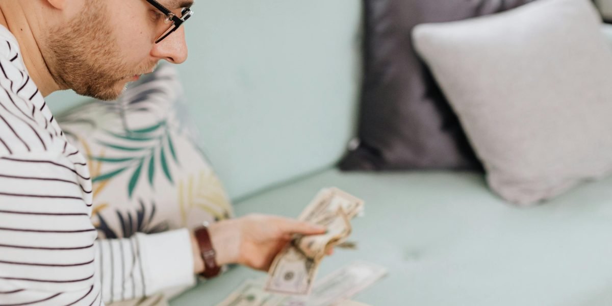 A person thoughtfully considering long-term financial strategies and investment choices.