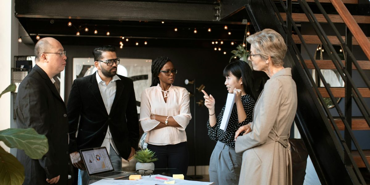 Clients engage in a productive discussion with real estate professionals in a centralized hub.