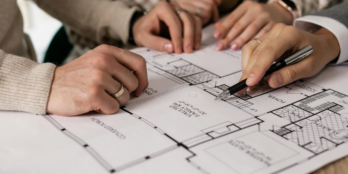 An individual compares property options and advice from a real estate advisor for their journey.
