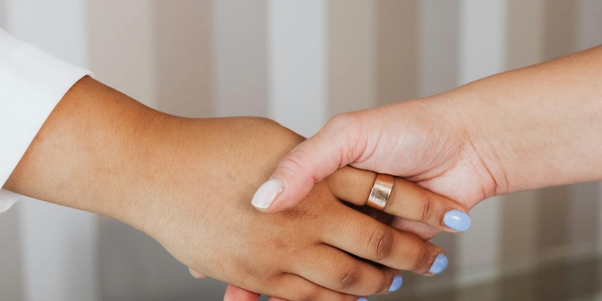 A handshake symbolizing agreement and successful collaboration after a meeting at a real estate center.
