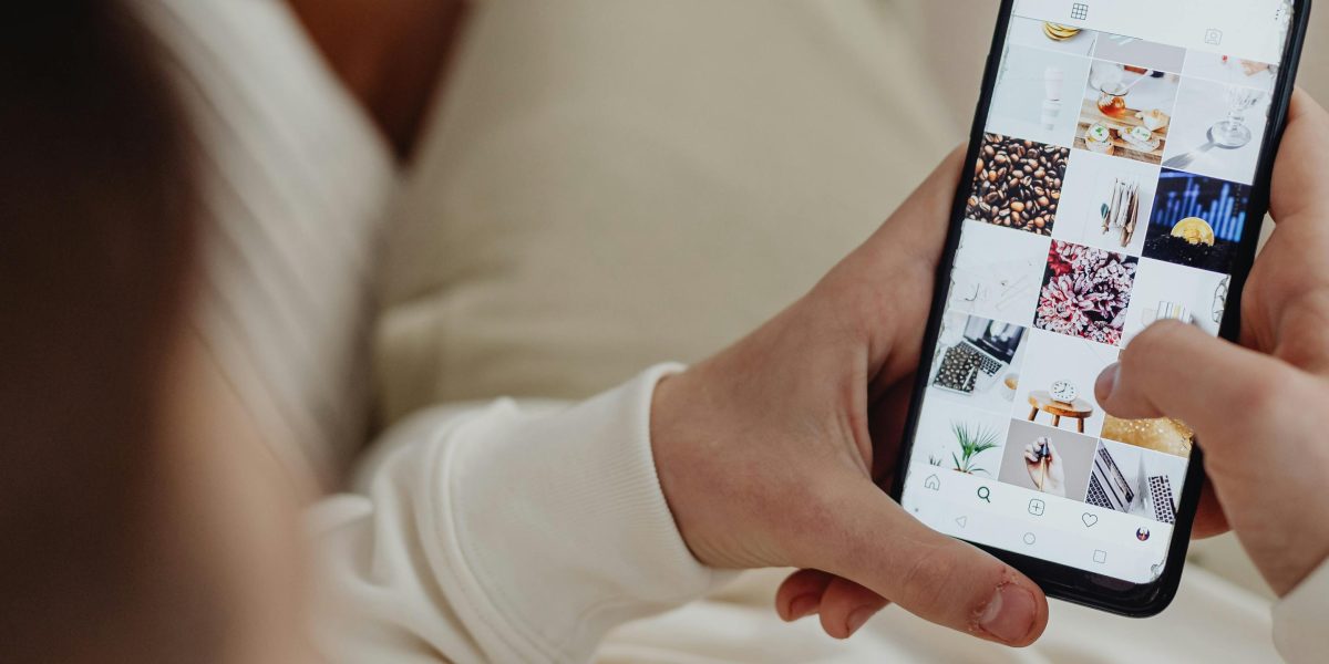 A person engages with real estate content on social media, reflecting the digital-first nature of Dubai's property market.