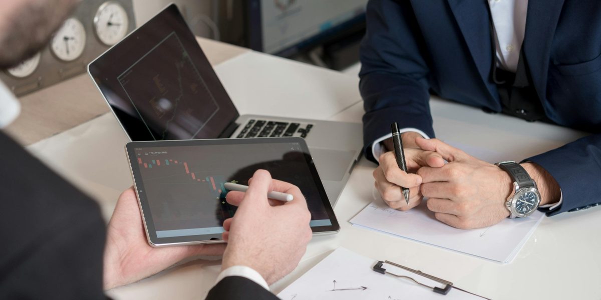 A business professional meticulously reviews data, symbolizing the strategic analysis required for targeted real estate advertising and investment decisions.