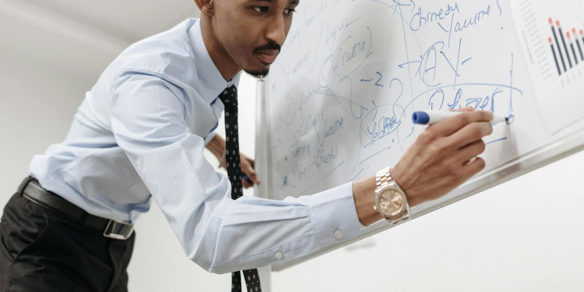 An individual effectively communicating ideas and strategies during a team meeting.