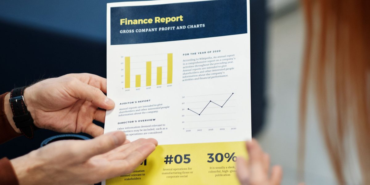 A group of business professionals engaged in a detailed discussion of financial reports and performance metrics.