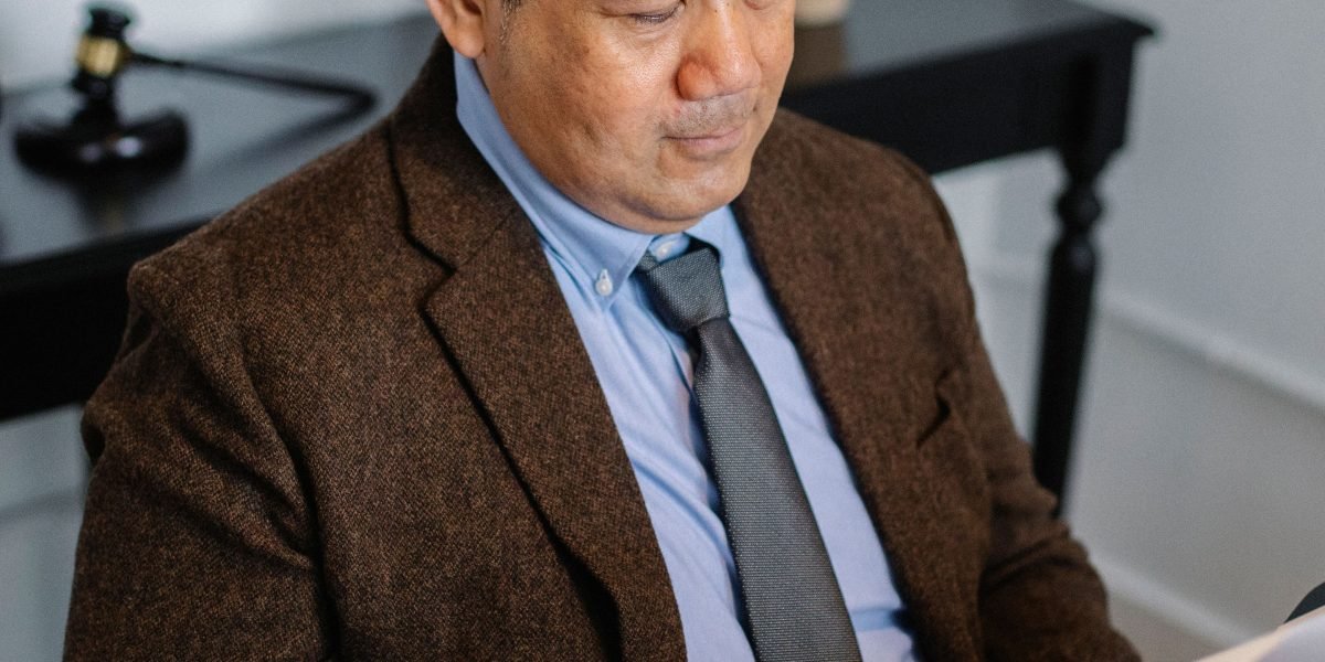 A confident person reviewing documents, symbolizing smart investment decisions in a stable market.