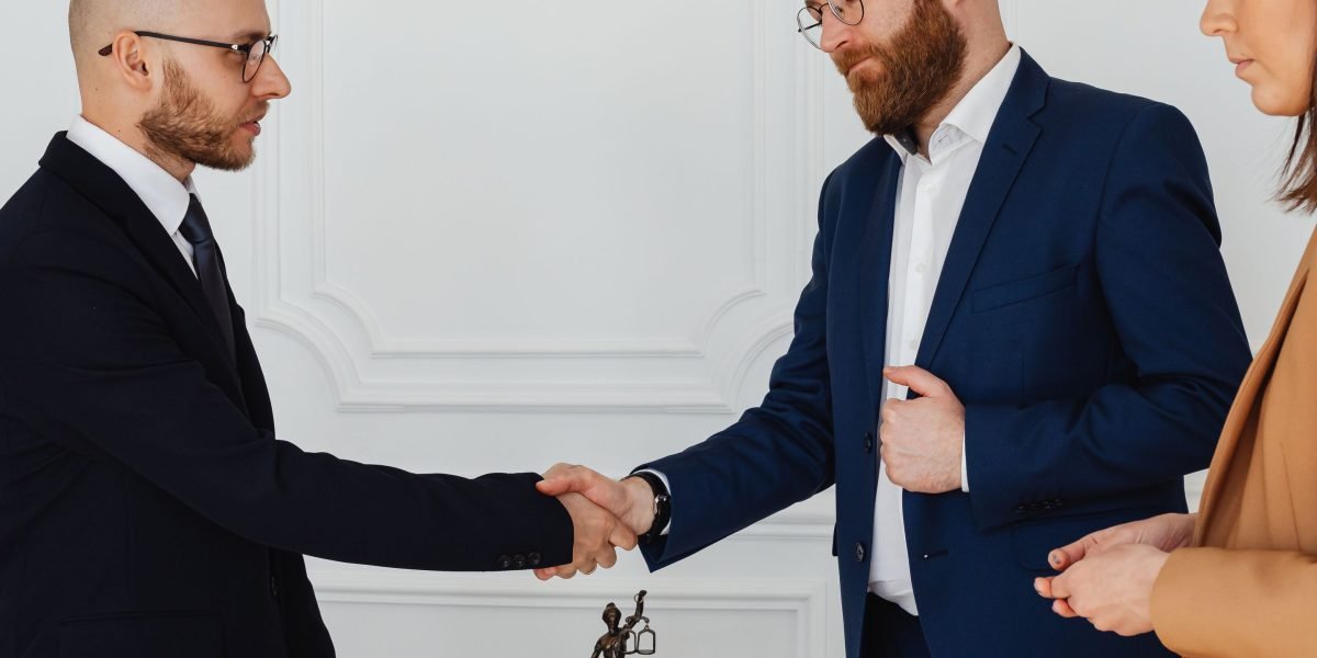 An investor consulting with a real estate advisor, emphasizing the value of expert guidance for strategic planning.