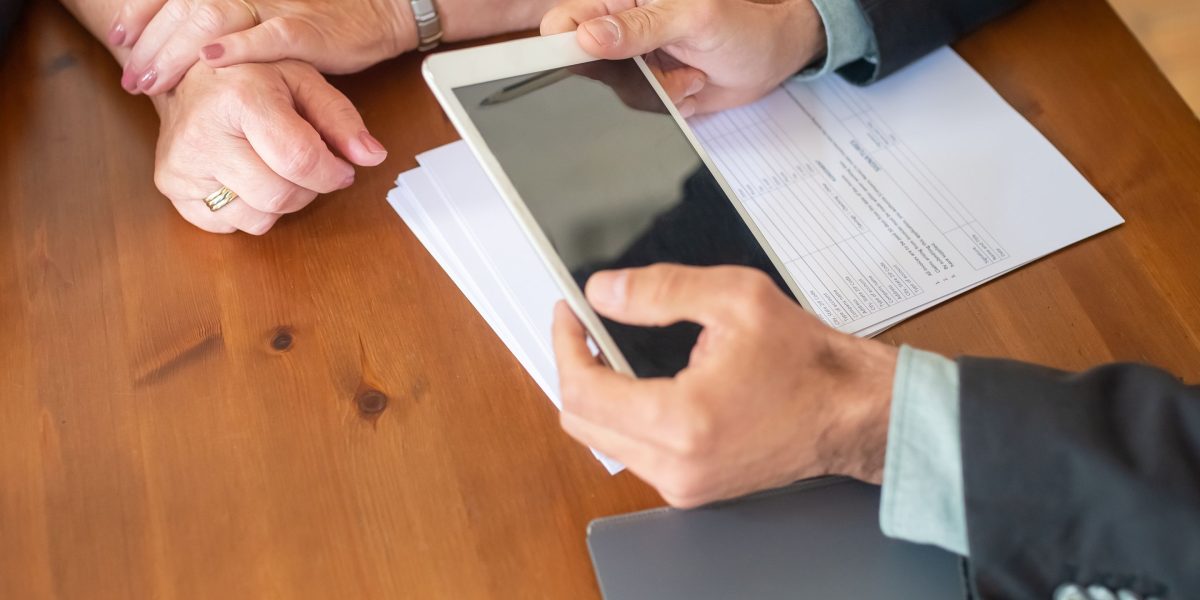 A person discussing financial prospects with an advisor, illustrating insights into salary and compensation.