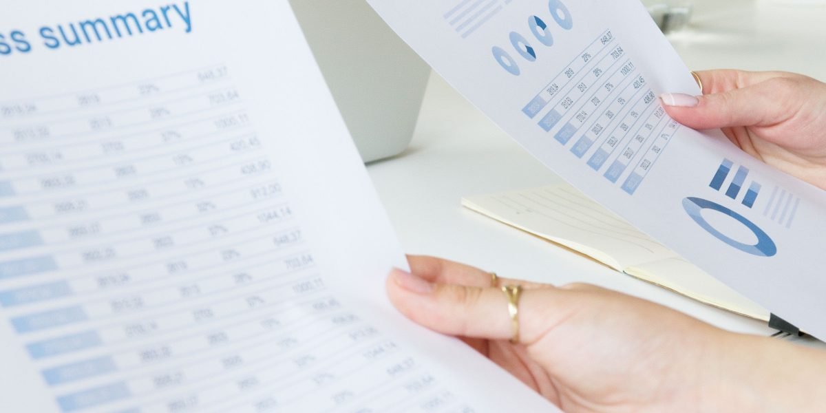 Professionals reviewing financial reports to assess yields, capital appreciation, and overall return on investment.