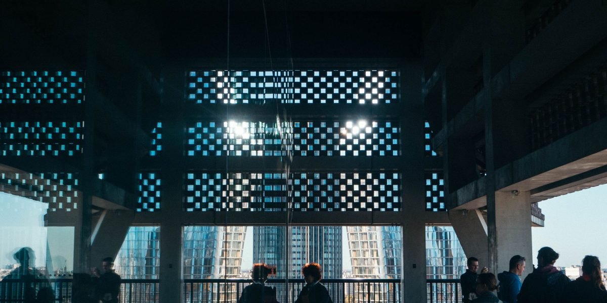 People observing the impressive and futuristic architecture of a modern city, reflecting megaproject impact.