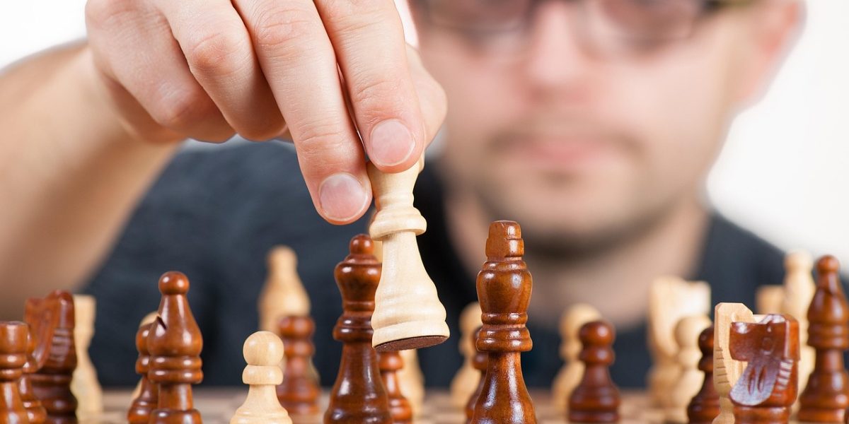 A person is deeply focused, contemplating their business strategy, emphasizing the need for clear market definition.