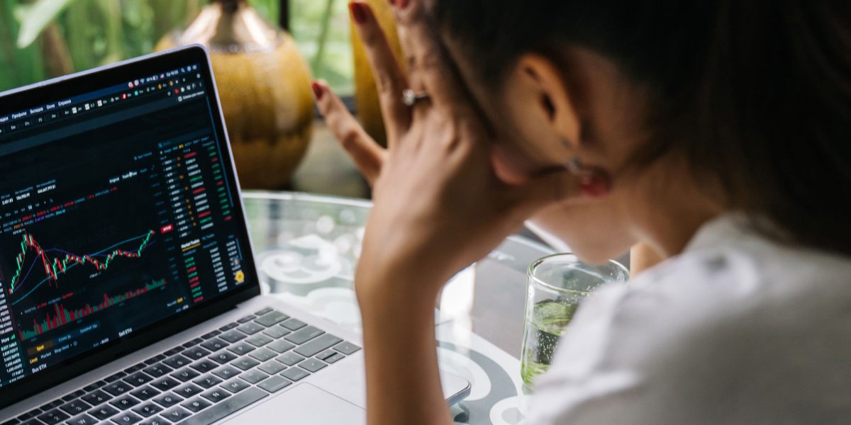 A person thoughtfully considering options, symbolizing the importance of informed investment decisions in real estate.