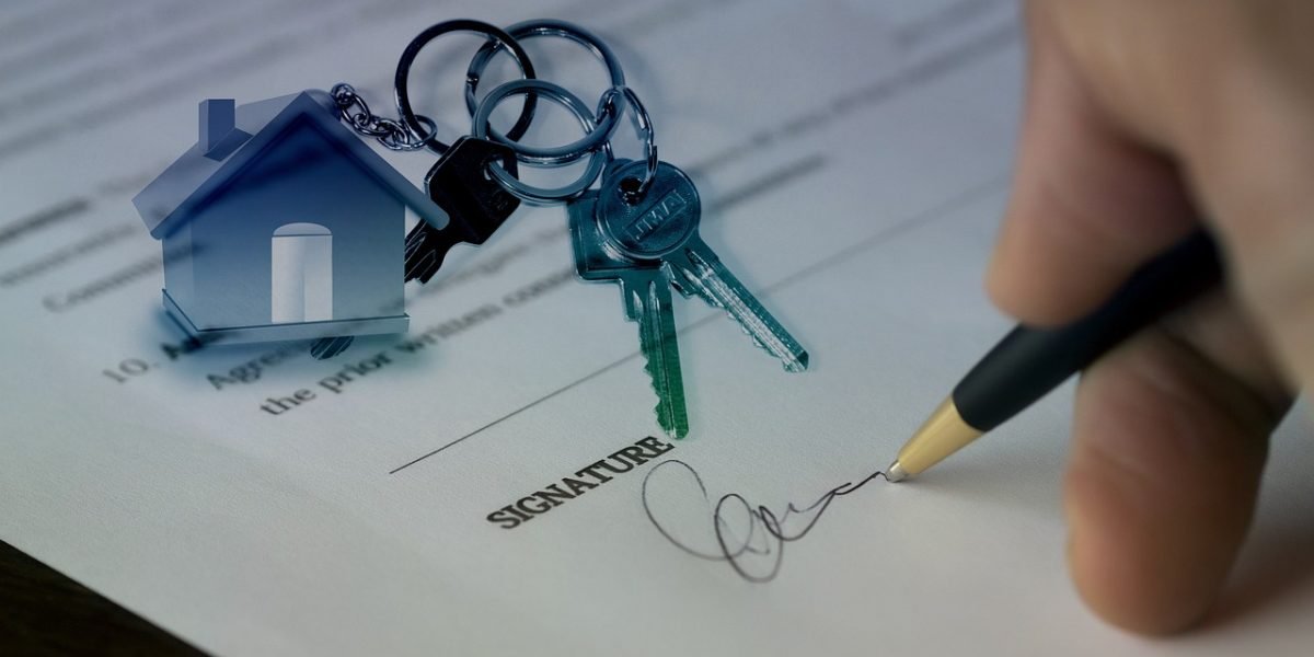A client meeting with a real estate agent, discussing property options and investment strategies.