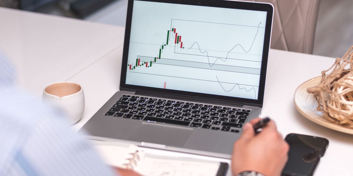 An investor intently studying market data to make informed decisions about real estate cycles.
