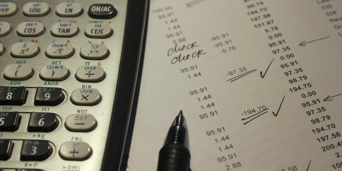 A person focused on analyzing financial reports and market data, embodying the process of making informed investment decisions.