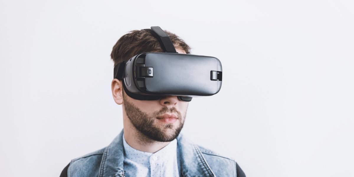 A person using a VR headset to experience a virtual property tour from the comfort of their home, showcasing remote exploration.