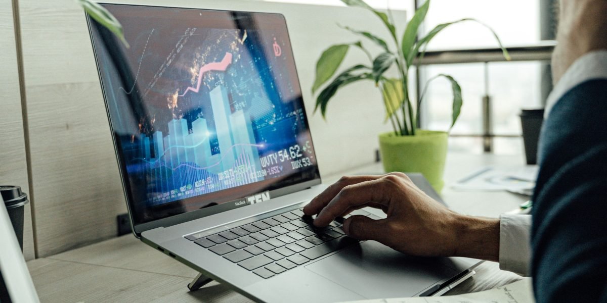 A thoughtful individual analyzing market trends, emblematic of a buyer contemplating a property investment.