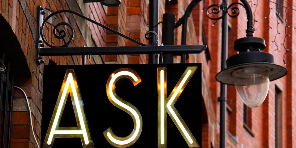 A candid conversation between a client and a real estate agent, demonstrating the process of asking smart questions to assess suitability.