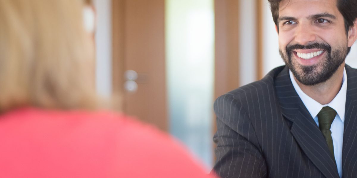 A candidate confidently participating in a job interview, demonstrating preparedness and professional interaction.